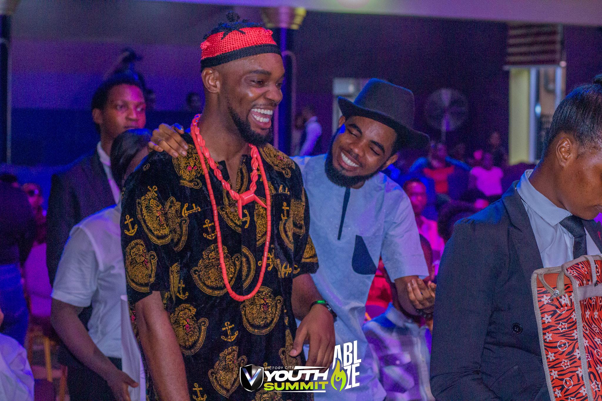 Young men celebrating together at the Youth Summit
